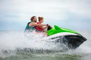 Family enjoying jet skiing on a Utah lake during a safe and fun water sports activity