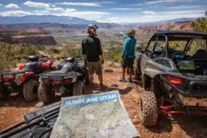 ATV riders planning a weekend trail ride with rentals overlooking scenic desert landscape in Hurricane Utah